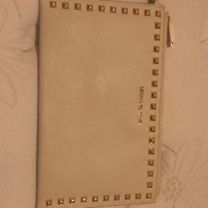 Michael Kors cream wristlet bag